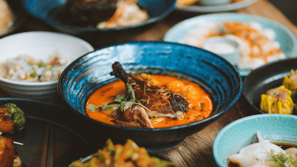 Table full of vibrant modern Asian dishes from Dragonfly restaurant Wellington.