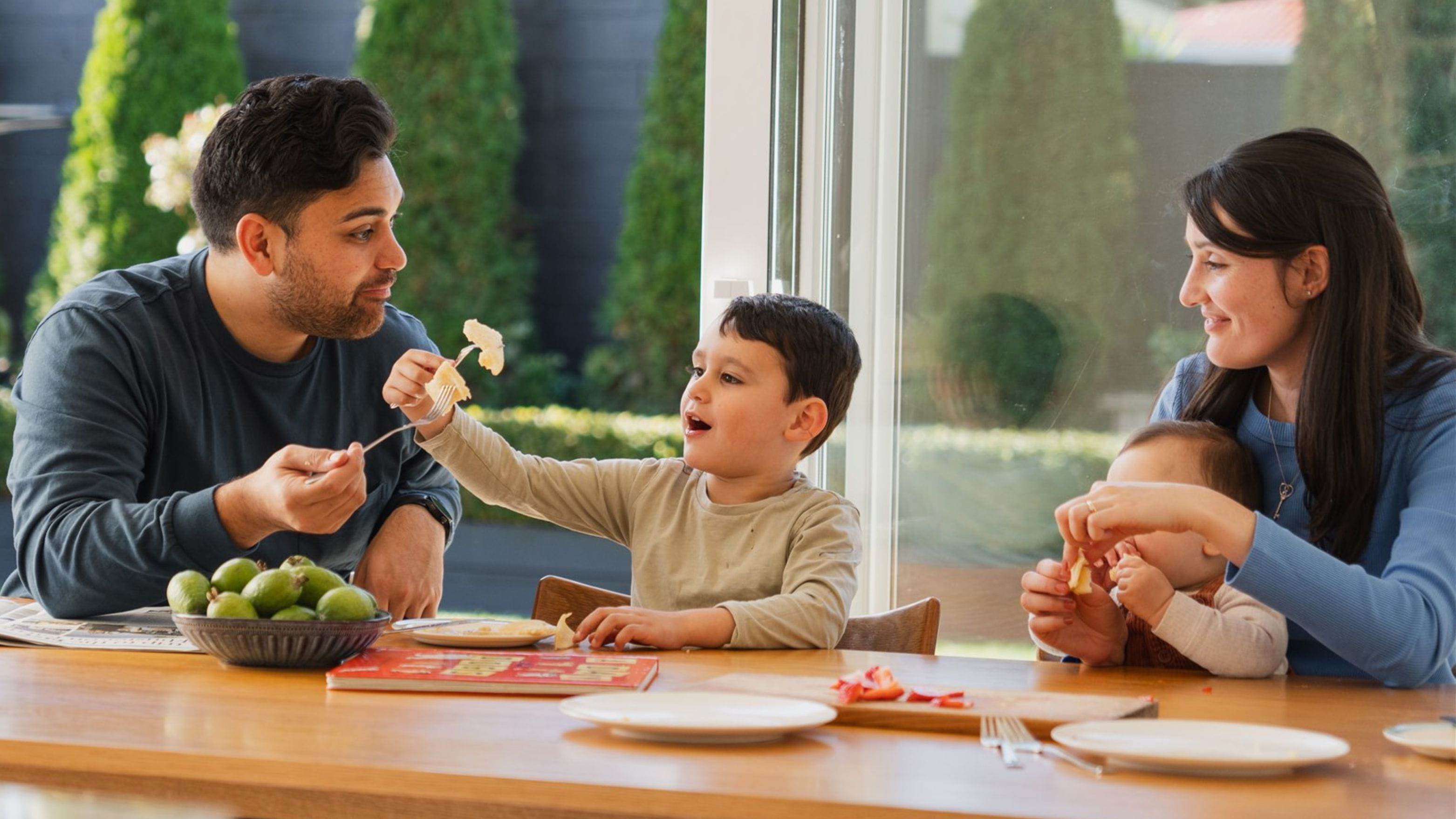 family eating pancakes up dinner table