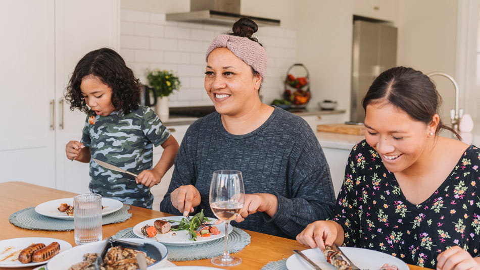 family eating up dinner table