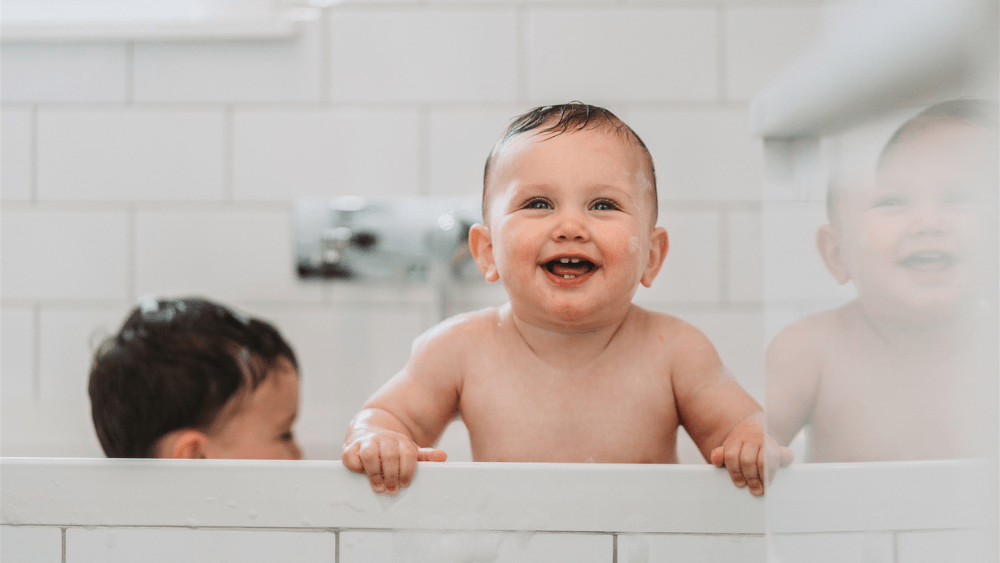Kids enjoy a bath heated with gas hot water.