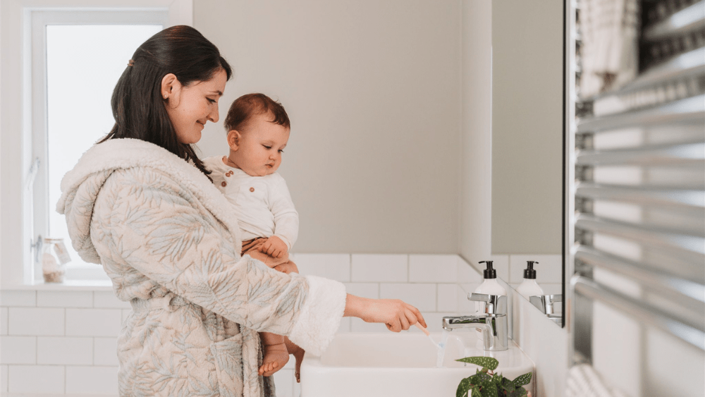 Mother and son getting ready to brush their teeth.