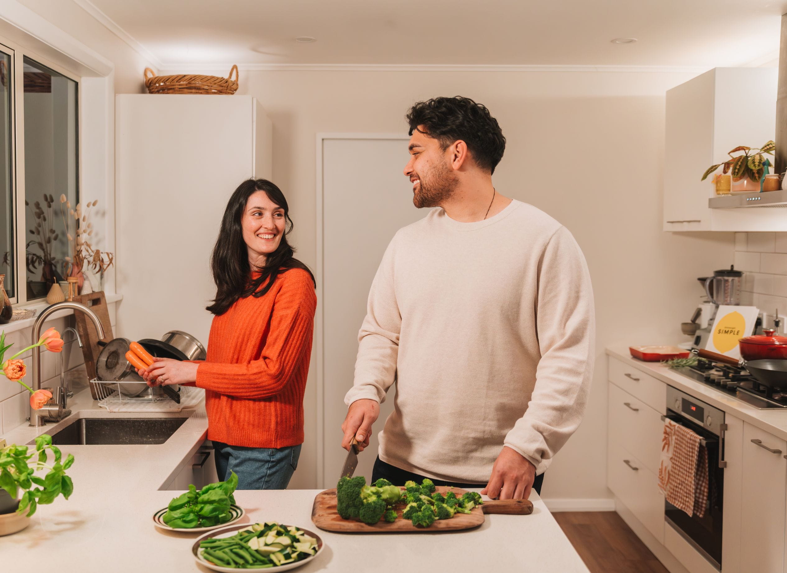 Couple preparing dinner in the kitchen.